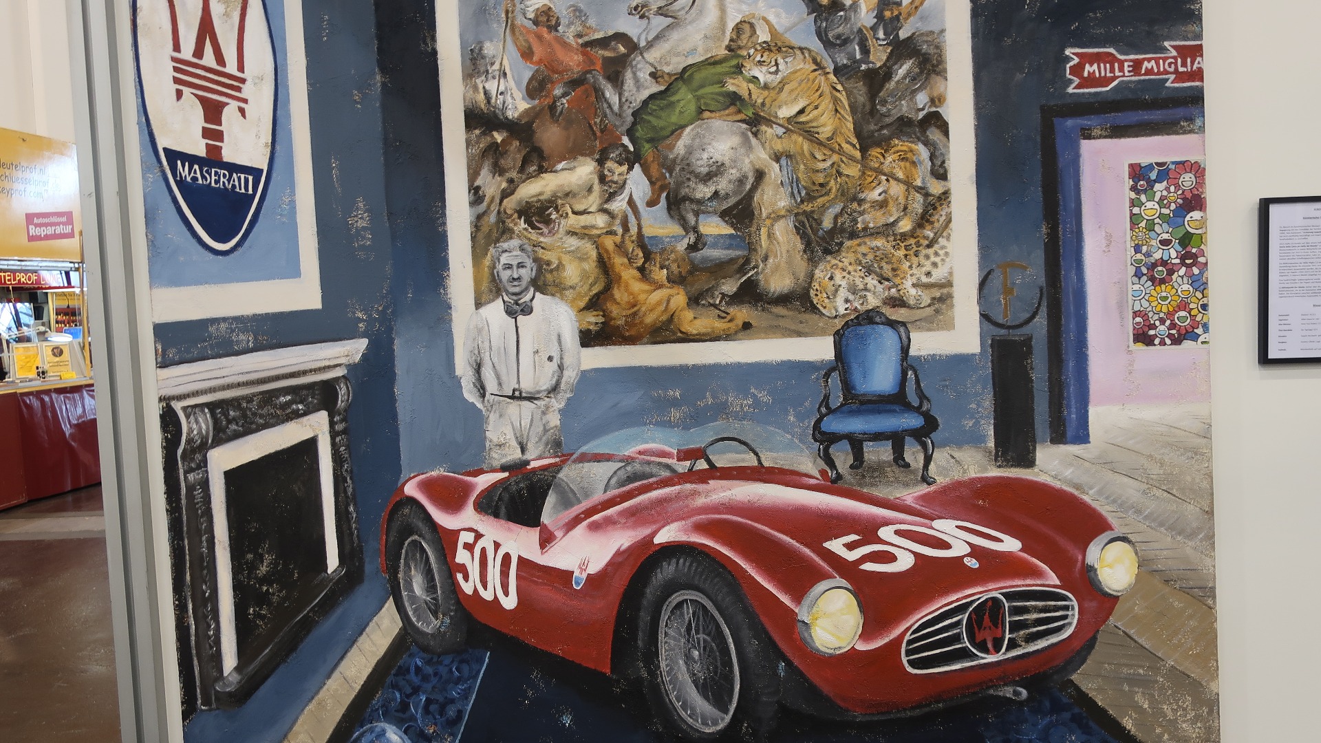 Her skjer det mye på en gang. Vi ser Alfieri Maserati i Mille Miglia 1954 og en Maserati A6 GCS, men kunstneren Ferencz Olivier har også blandet inn Peter Paul Rubens sitt maleri Tigerjakten fra 1615.